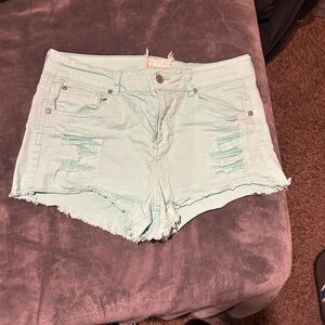 Altar'd State Green Jean Shorts with Frayed Hem and Distressed Details